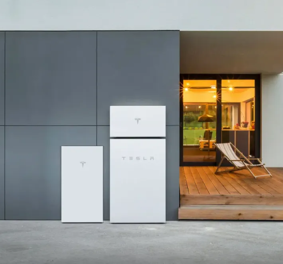 Tesla Powerwall 3 home battery installed on the exterior of a modern home